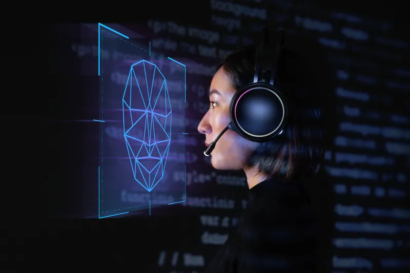 female-programmer-scanning-her-face-with-biometric-security-technology-virtual-screen-digital-remix